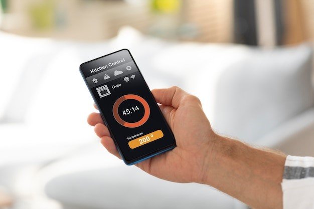 Man holding smartphone with thermostat automation. 